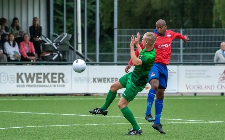 Soccer players competing for the ball during an outdoor match