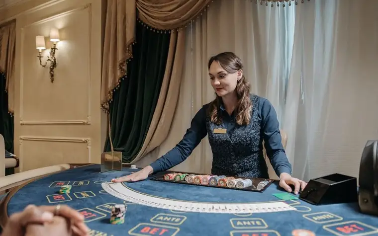 Dealer at an elegant casino baccarat table