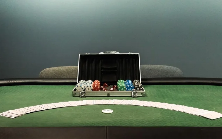 Poker table set up with chips and cards