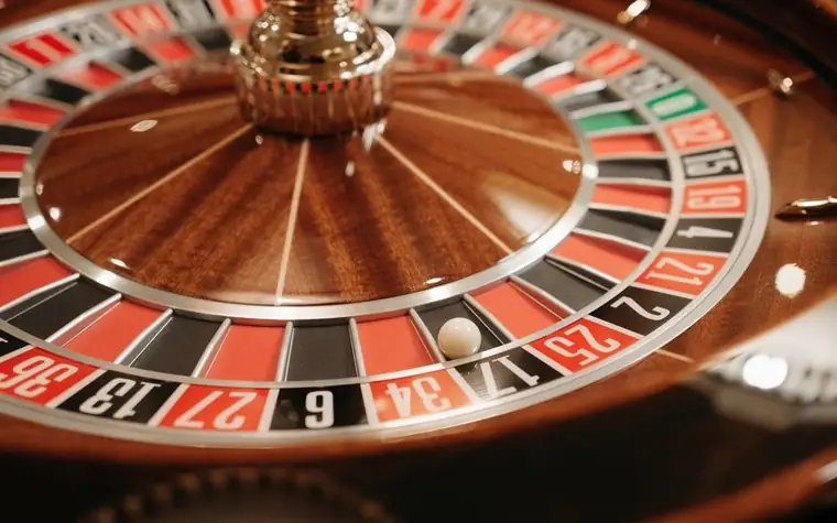 Close-up of a spinning roulette wheel with the ball