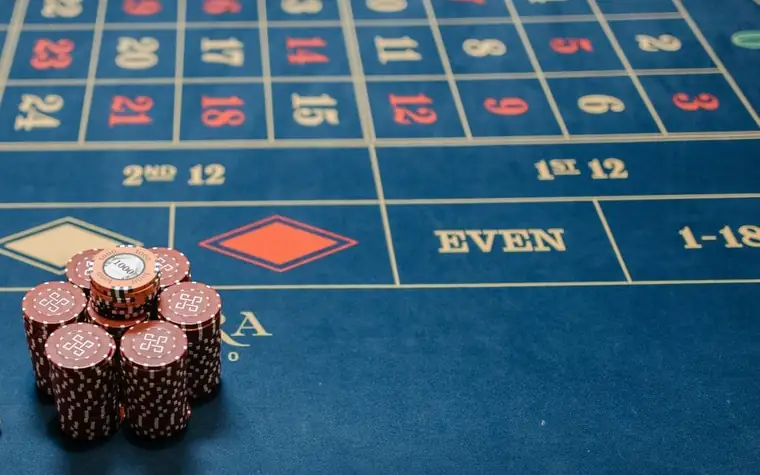Roulette table with stacked poker chips