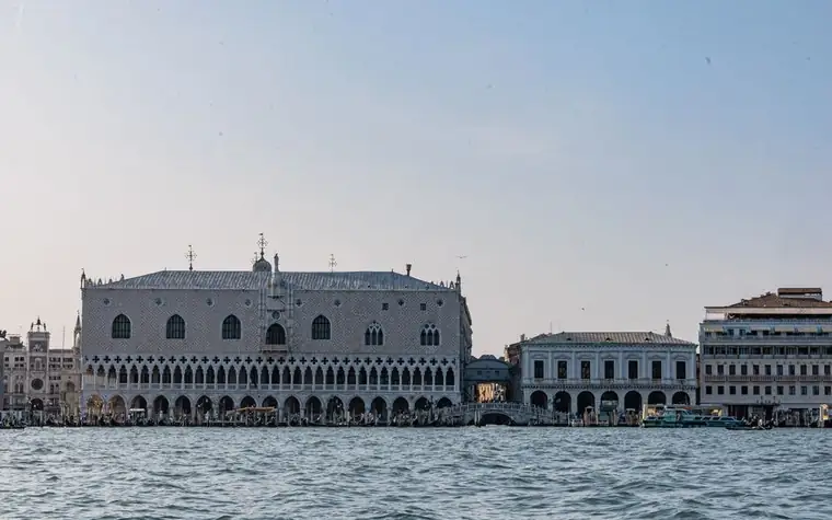 The Doge's Palace and waterfront arcades in Venice, seen from across the water