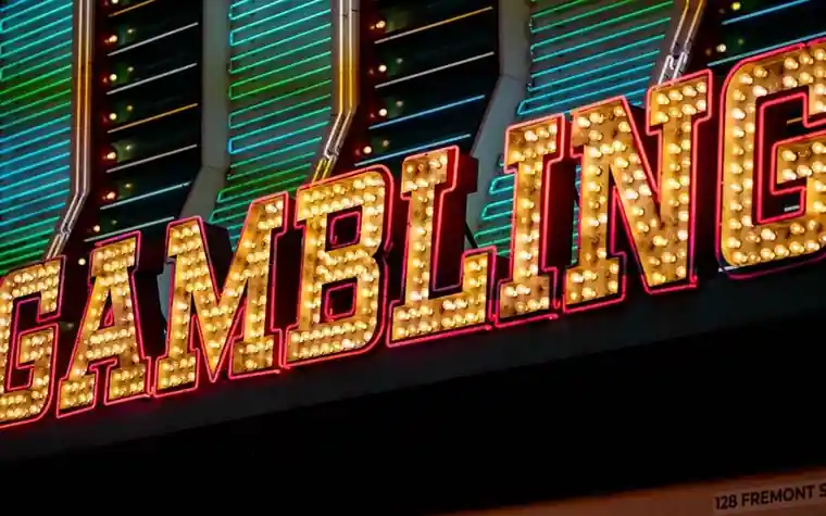Bright neon gambling signage illuminated at night on Fremont Street in downtown Las Vegas