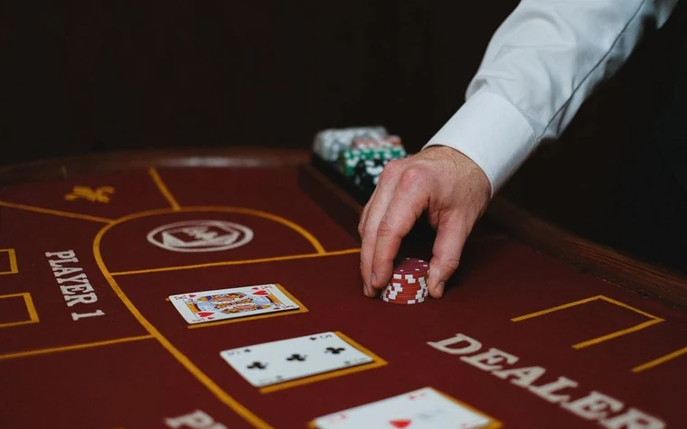 Casino cashier cage window where a guest exchanges chips with a clerk