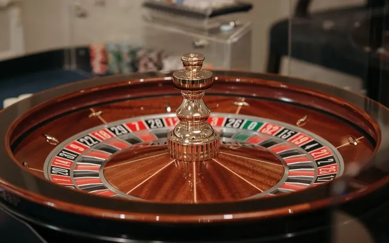 Close-up of a roulette wheel with the ball settling into a numbered pocket