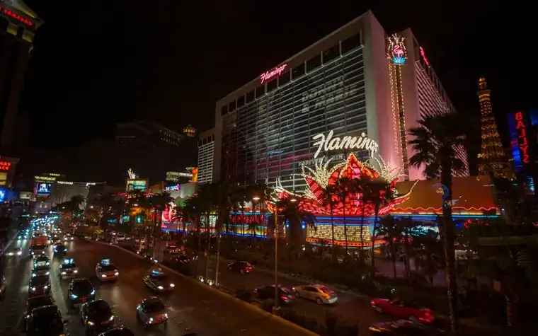 Flamingo casino resort lit up on the Las Vegas Strip at night
